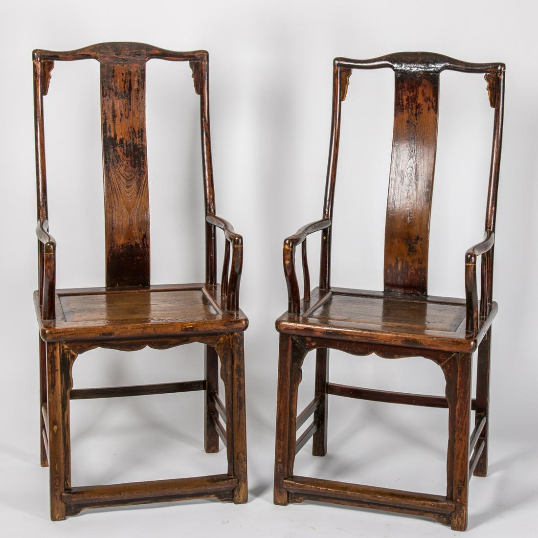 A Pair of Chinese Stained Elm Armchairs, 19th/20th: A Pair of Chinese Stained Elm Armchairs, 19th/20th Century. H: 48 1/2 W: 21 3/4 D: 17 in.
