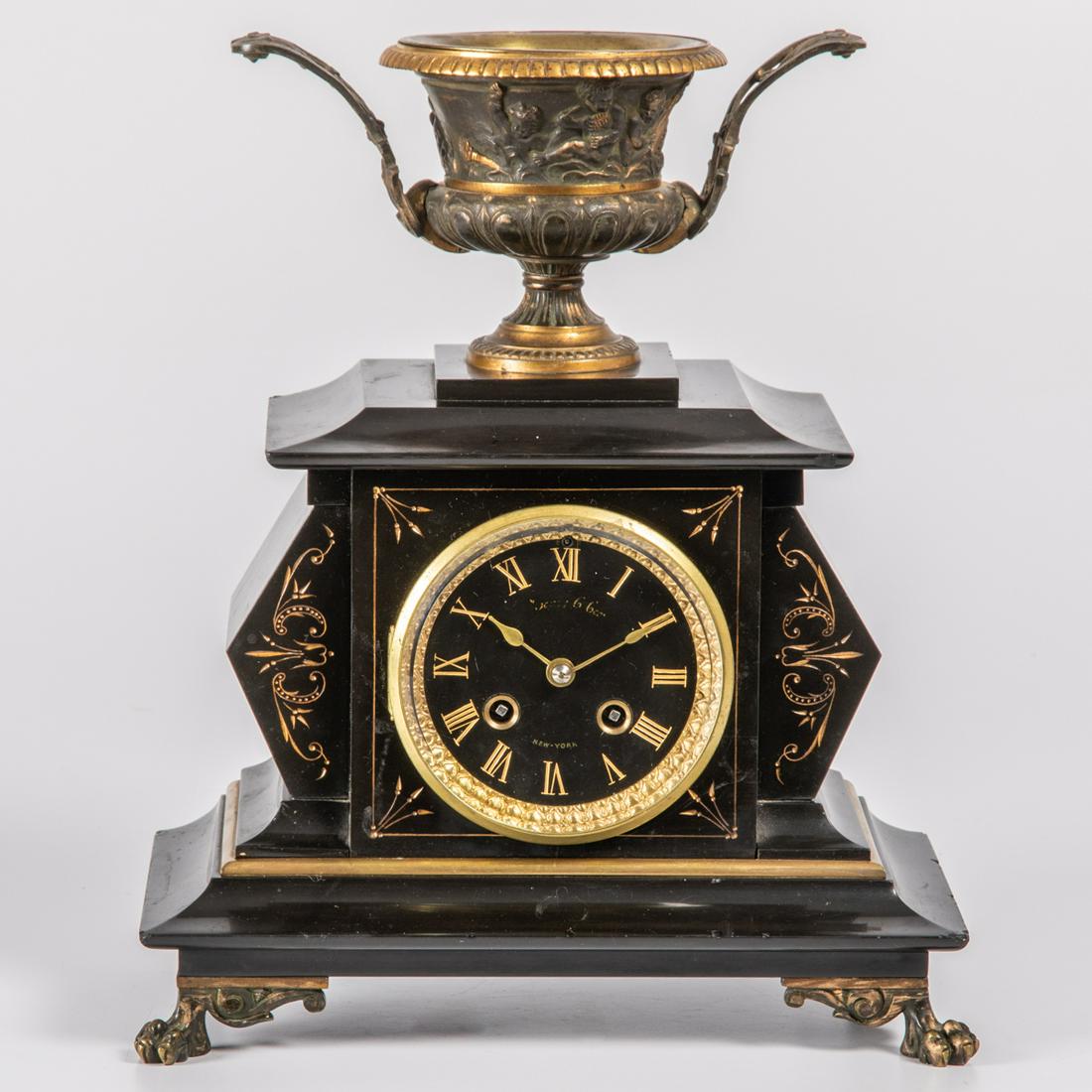 A J&J Cox, New York, Carved Black Onyx with Gilt: A J&J Cox, New York, Carved Black Onyx with Gilt Highlight Mantel Clock, 19th Century, Having key and pendulum. H: 12 3/4 W: 10 3/4 D: 6 3/4 in.