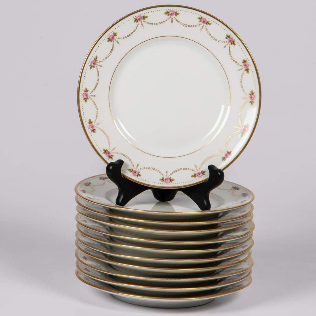 A Set of Eleven Bernardaud & Co. Limoges Porcelain: A Set of Eleven Bernardaud & Co. Limoges Porcelain Salad Plates, 20th Century, Having pink roses, gold swags and dots (BER126). D: 7 3/8 in.