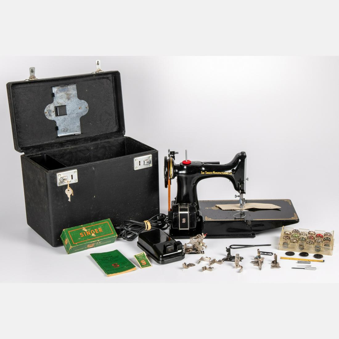 A Vintage Singer Sewing Machine with Case, 20th: A Vintage Singer Sewing Machine with Case, 20th Century. H: 11 W: 14 1/4 D: 9 in.