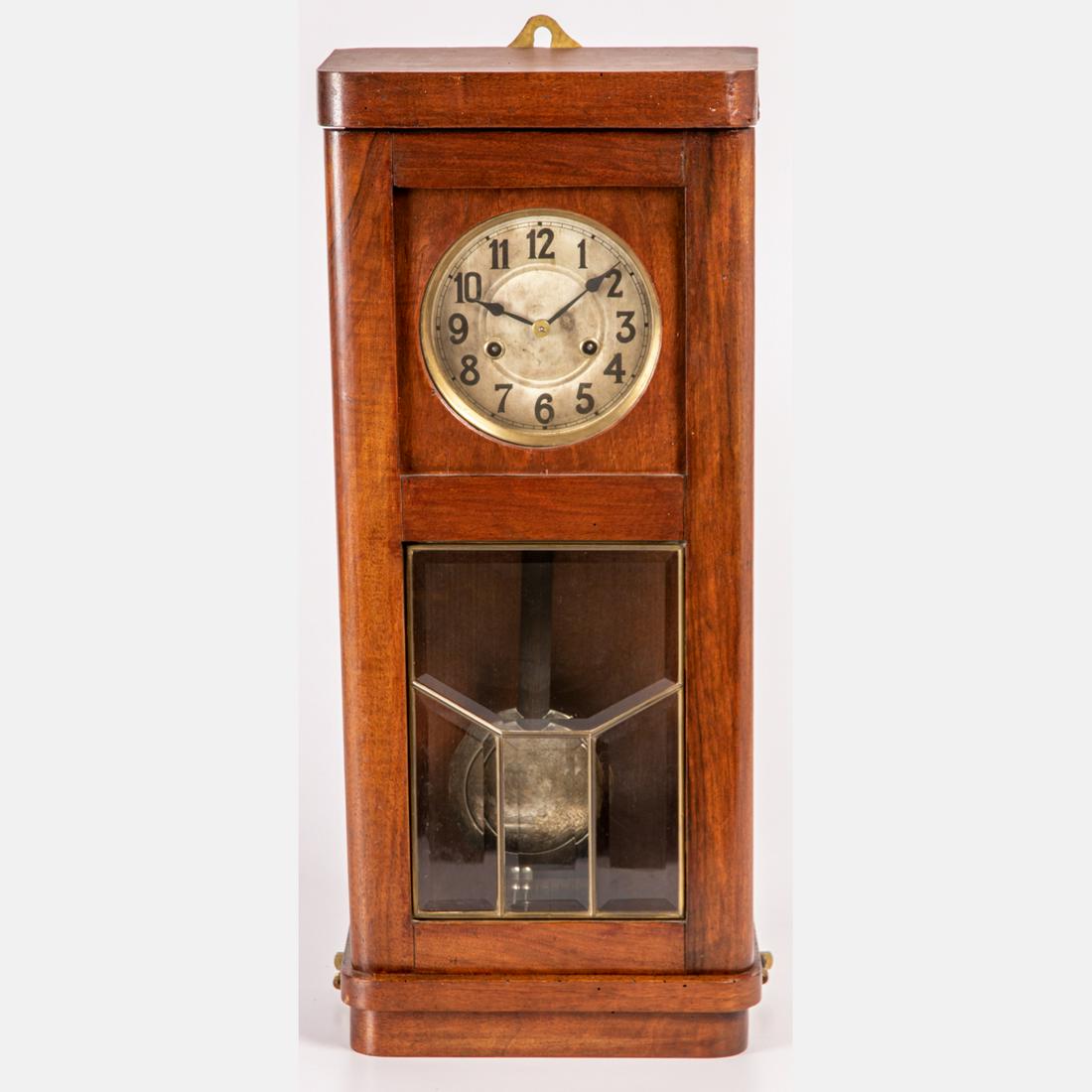 An American Arts and Crafts Style Walnut Wall Regulator: An American Arts and Crafts Style Walnut Wall Regulator Clock, 20th Century, Not in working order. H: 24 1/2 W: 10 1/2 D: 5 1/2 in.