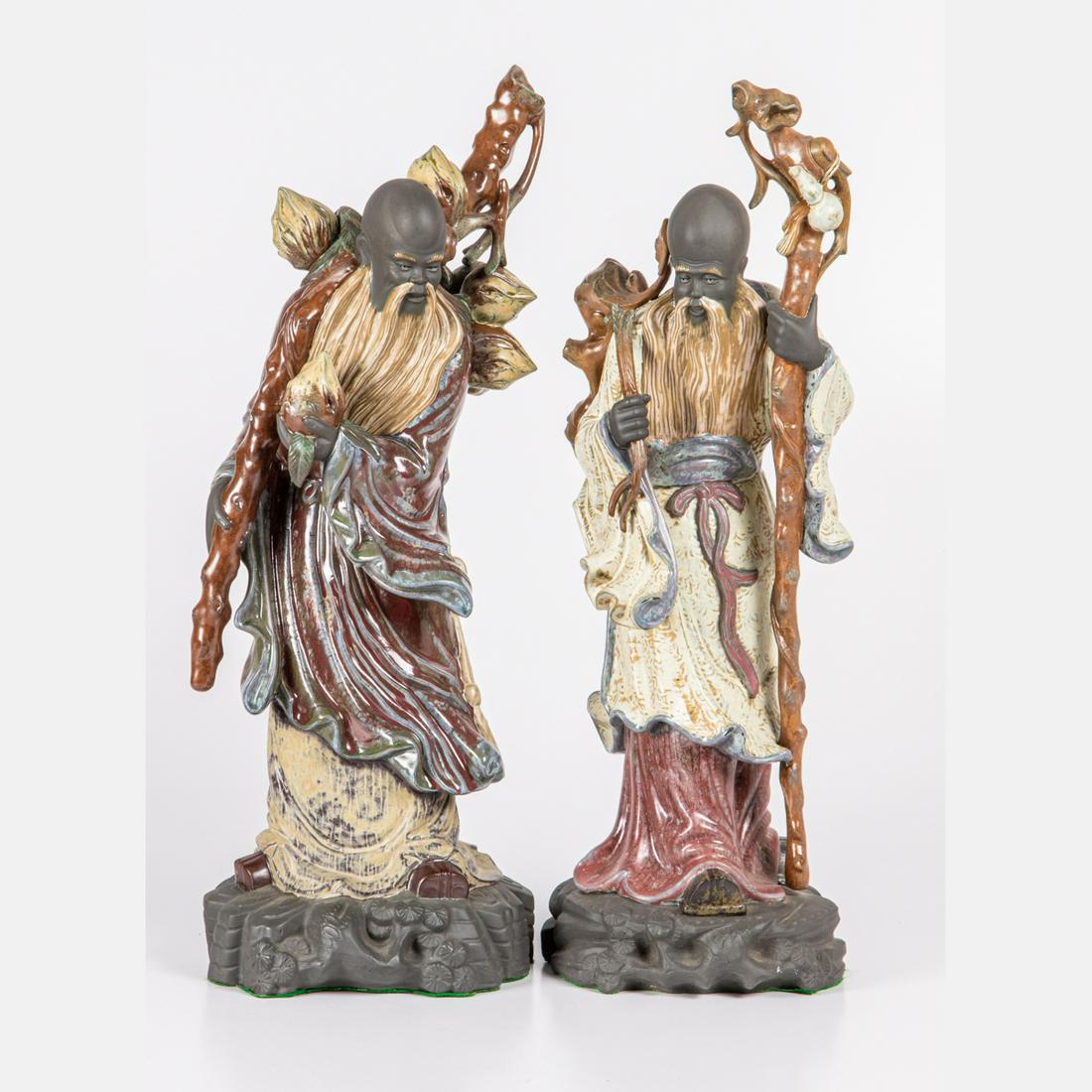 Two Lladro Gres Porcelain Figures Chinese Farmers: Two Lladro Gres Porcelain Figures titled Chinese Farmer with Staff, 20th Century. Sculpted by Jose Roig. Issued in 1977 and retired in 1985. Largest dimensions: h: 22 x w: 7 x d: 9 in.