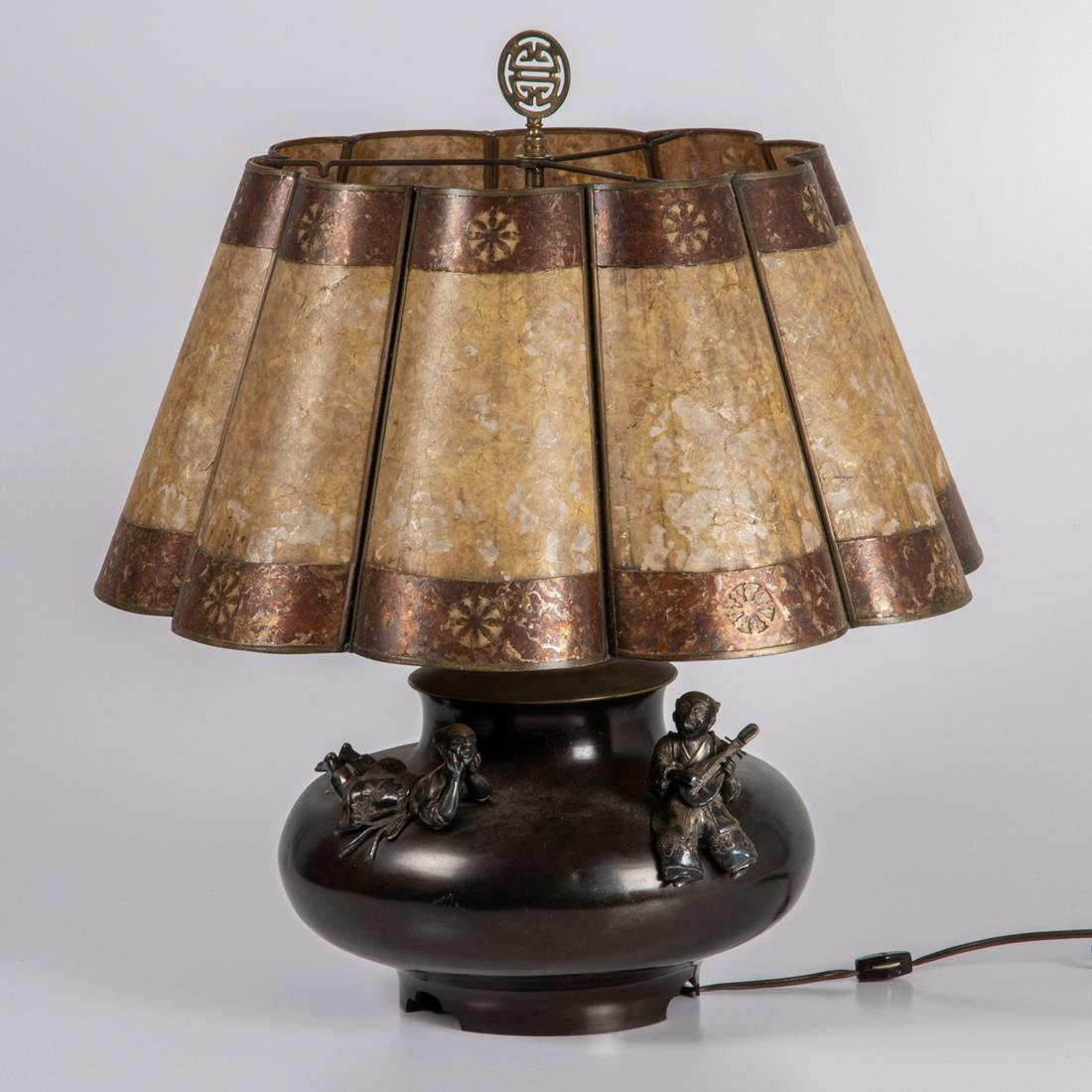 A Japanese Vase Mounted as a Lamp, Meiji Period,: A Japanese Bronze and Silvered Metal Vase Mounted as a Lamp, Meiji Period. With a molded mica and metal shade. H: 24 D: 20 in.
