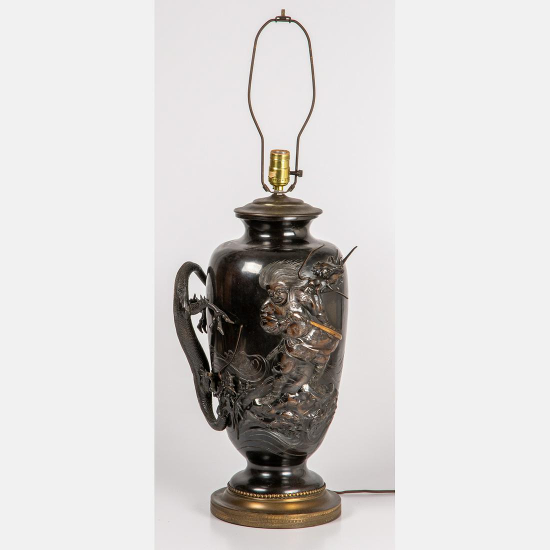 A Japanese Bronze Dragon Vase Mounted as a Lamp, Meiji: A Japanese Bronze Dragon Vase Mounted as a Lamp, Meiji Period. Dimensions without shade harp: H: 24 x W: 10 x D: 9 1/2 in.