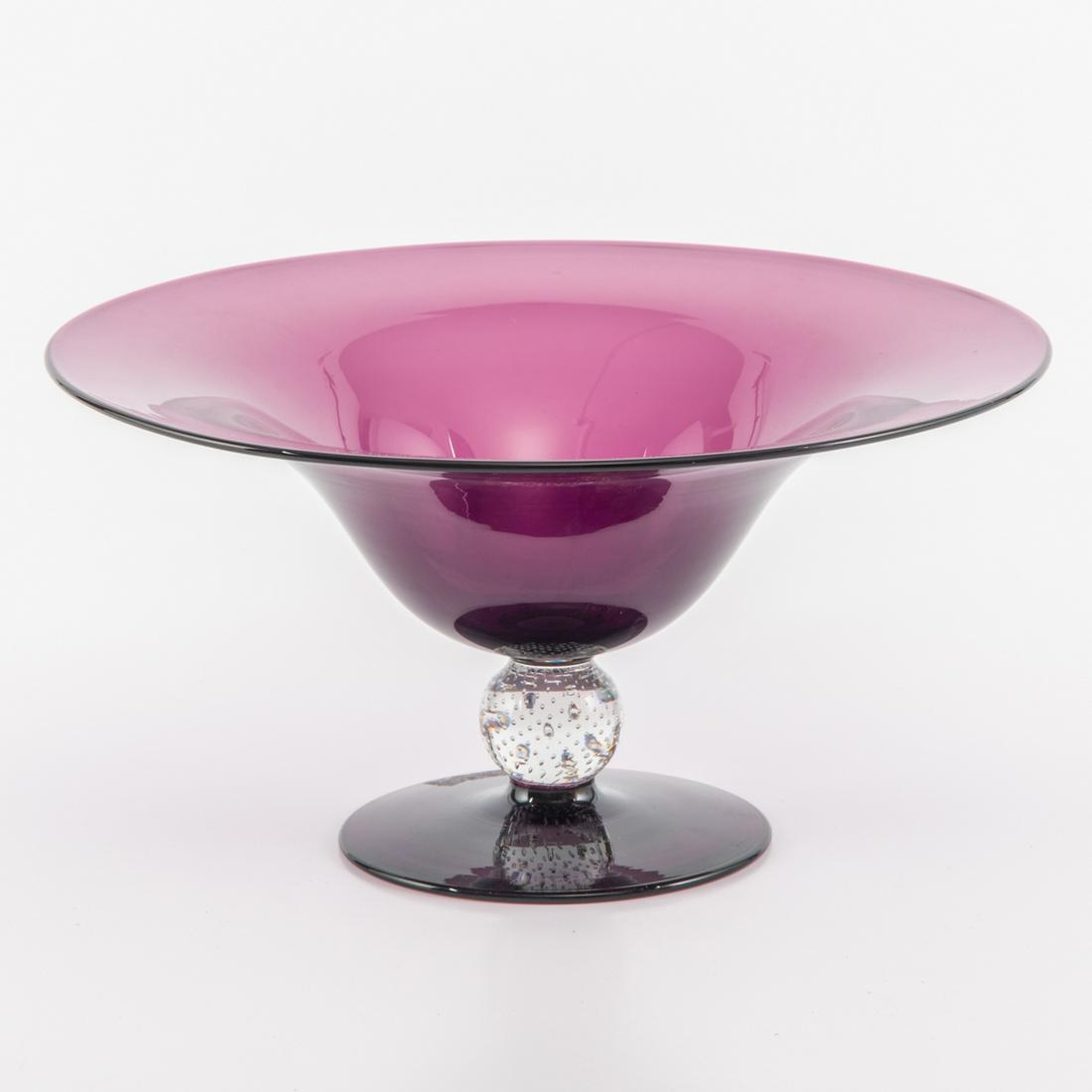 A Pairpoint Amethyst Glass Footed Center Bowl, 20th: A Pairpoint Amethyst Glass Footed Center Bowl, 20th Century,Unsigned. H: 6 1/2 W: 12 1/4 in.