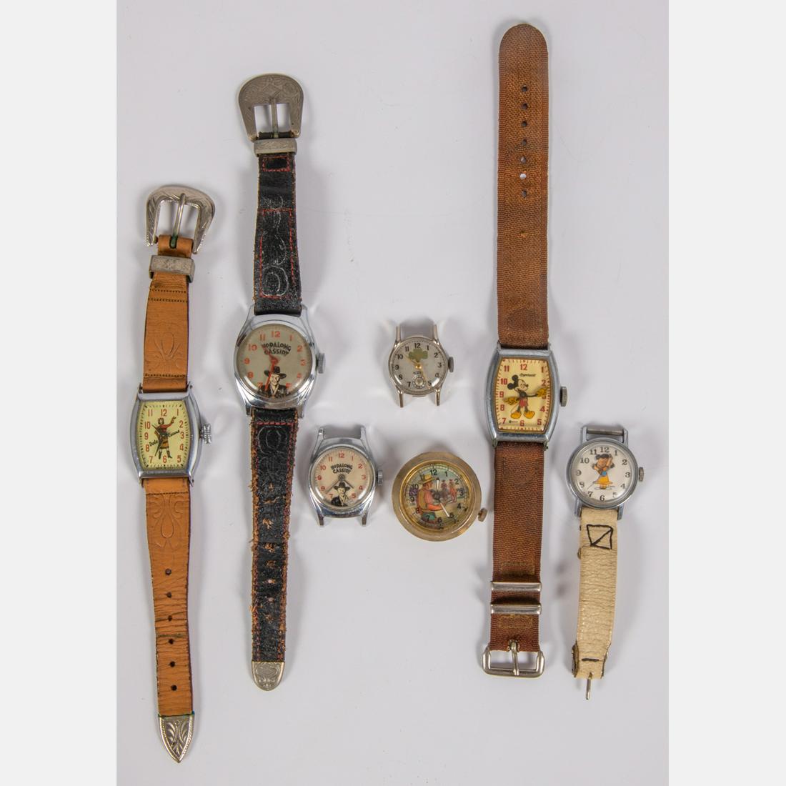 A Collection of Seven Entertainment Themed Watches,: A Collection of Seven Entertainment Themed Watches, 20th Century,Including Peanuts, Mickey Mouse, Hopalong Cassidy, Dale Evans and Girl Scouts.