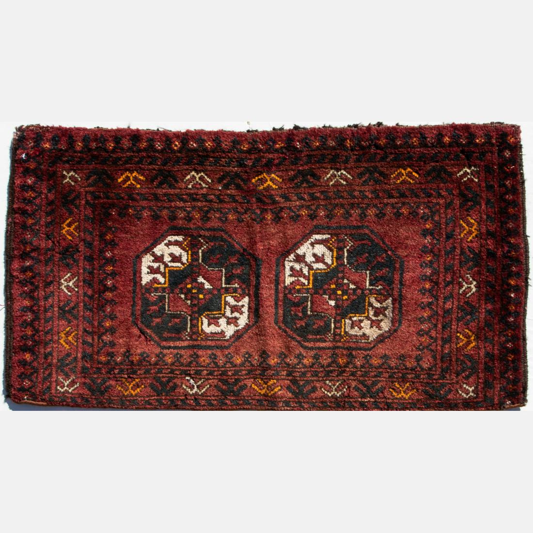 An Antique Persian Turkoman Wool Rug, 20th Century.: An Antique Persian Turkoman Wool Rug, 20th Century.Dimensions: 1 ft. 5 in. x 2 ft. 8 in.