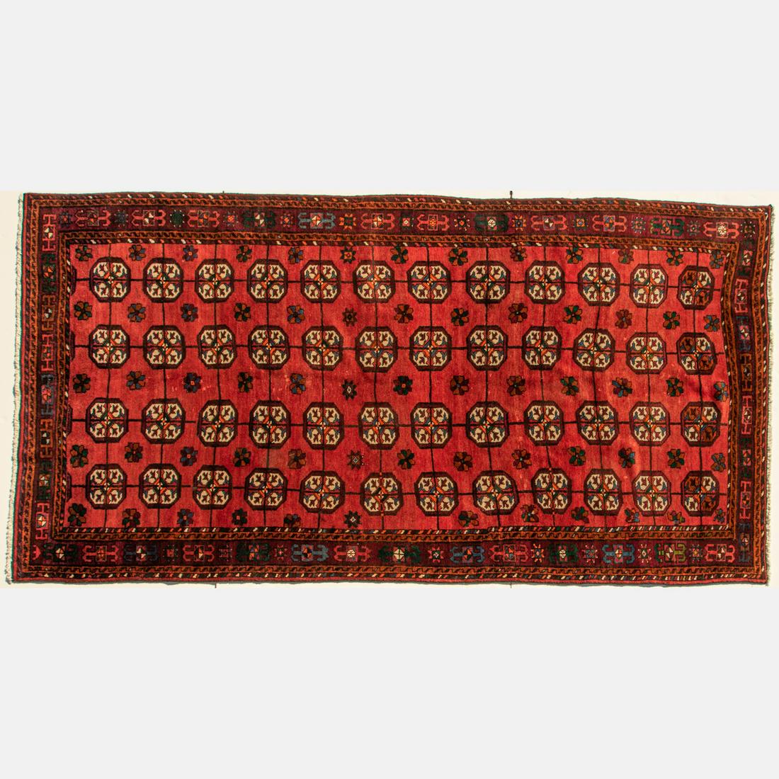 A Persian Turkoman Wool Rug, 20th Century. (1 of 4)