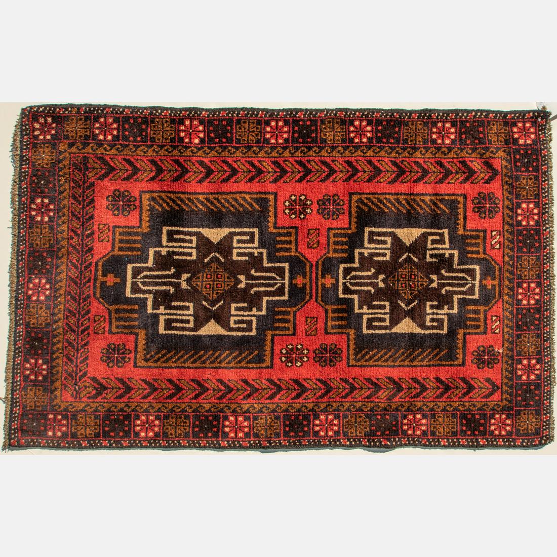 An Afghani Turkoman Wool Rug, 20th Century. (1 of 4)
