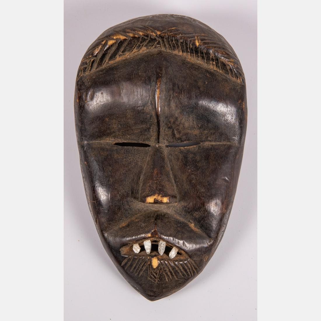 An African Dan Mask, Ivory Coast, 20th Century, (1 of 4)