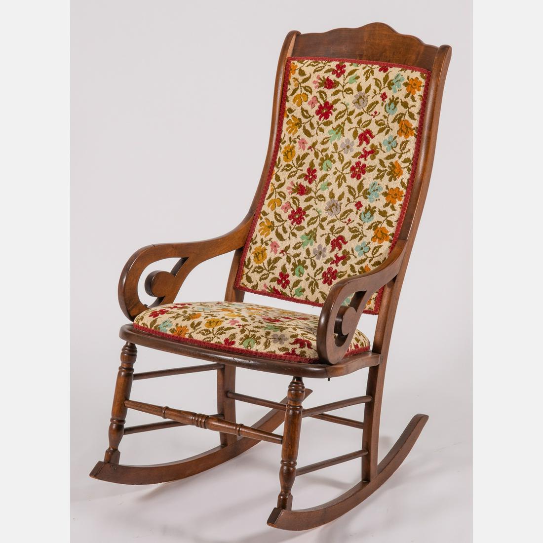 An American Walnut Rocking Chair, Early 20th Century.: An American Walnut Rocking Chair, Early 20th Century. H: 40 W: 22 D: 31 in.