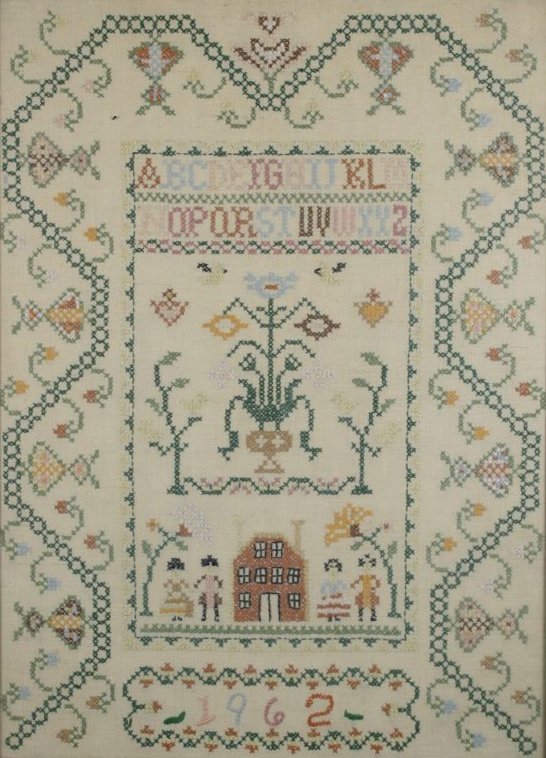 An Embroidered Sampler, dated 1962, with Alphabet, : An Embroidered Sampler, dated 1962, with Alphabet, House and Family Scene, Unsigned. Note Condition: some staining. H: 22 W: 16