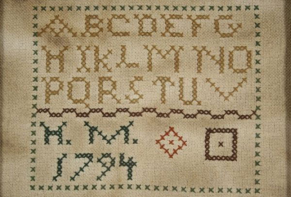 An Embroidered Sampler, dated 1794, Initialled H.M.: An Embroidered Sampler, dated 1794, Initialled H.M., with partial alphabet, Initialled and dated. Note Condition: yellowing with age. H: 4.50 W: 6.75