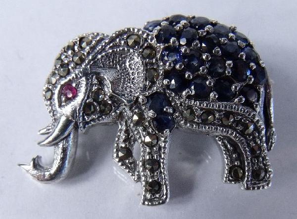 A Sterling Silver, Garnet, Sapphire and Marcasite : A Sterling Silver, Garnet, Sapphire and Marcasite Elephant Form Brooch. Stamped 925