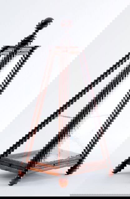 A Georgian Style Walnut and Glass Four Panel Obelis: A Georgian Style Walnut and Glass Four Panel Obelisk Display Case, 20th Century. Height: 40.5" Width: 17.5" Depth: 6.75"