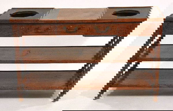 A Georgian Style Mahogany Diminutive Serving Table,: A Georgian Style Mahogany Diminutive Serving Table, 20th Century, with a fitted center drawer and wine coolers. Height: 27.5" Width: 45" Depth: 15"