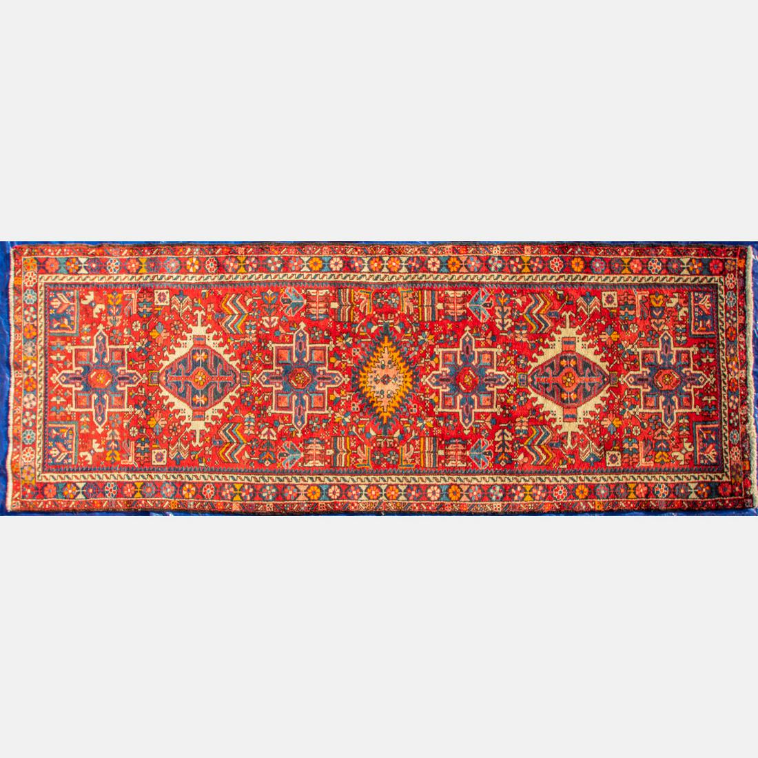 A Persian Heriz Wool Runner, 20th Century. (1 of 4)