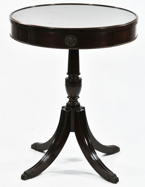 A Regency Style Mahogany Circular Side Table with: A Regency Style Mahogany Circular Side Table with Drawer, 20th Century. Height:27 Width:22 Depth:22
