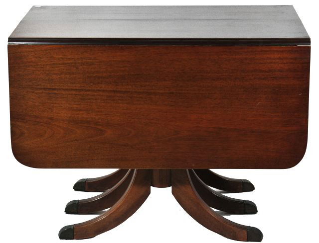 A Duncan Phyfe Style Mahogany Drop Leaf Dining Tab: A Duncan Phyfe Style Mahogany Drop Leaf Dining Table, 20th Century, with two leaves. Height: 29.5 Width: 84 Depth: 40