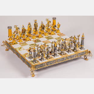 An Italian Gilt Metal and Marble Chess Set: An Italian Gilt Metal and Marble Crusades Themed Chess Set, 20th Century. H: 4 W: 23 1/2 D: 23 1/2 in.