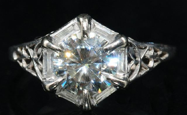 A Platinum Diamond and Moissanite Ring,: A Platinum Diamond and Moissanite Ring, Size, 4.75, 1/2 carat diamonds, 1 carat moissanite.