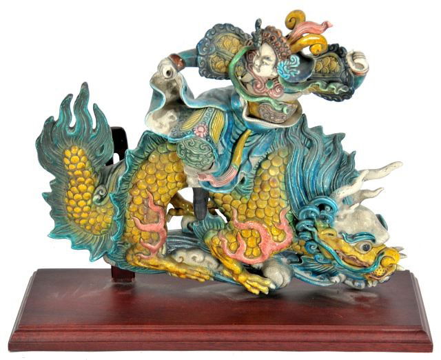 A Pair of Chinese Earthenware Roof Tile Decoration: A Pair of Chinese Earthenware Roof Tile Decorations, 20th Century, With polychrome glazing. HEIGHT: 13 WIDTH:16 DEPTH: 6