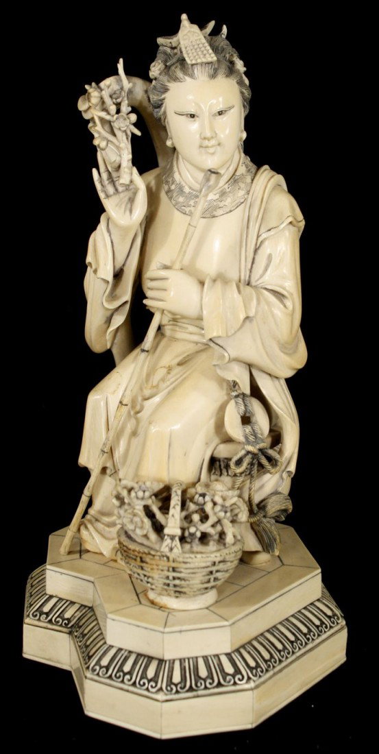 A Chinese Carved Ivory Figure of a Seated Guanyin,
