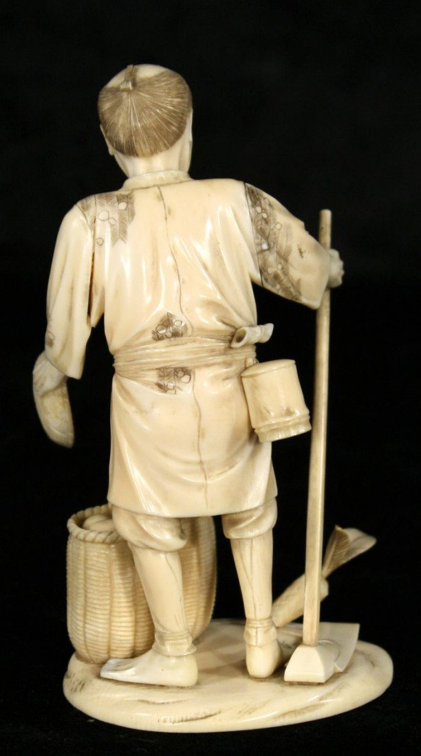 A Japanese Carved Ivory Figure of a Peasant Farmer, - 3