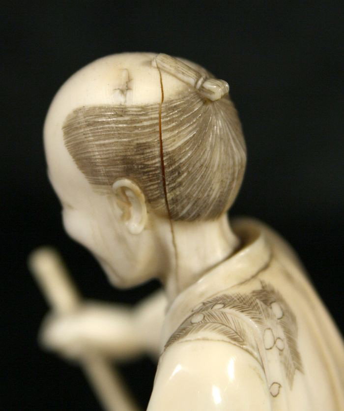 A Japanese Carved Ivory Figure of a Peasant Farmer, - 6