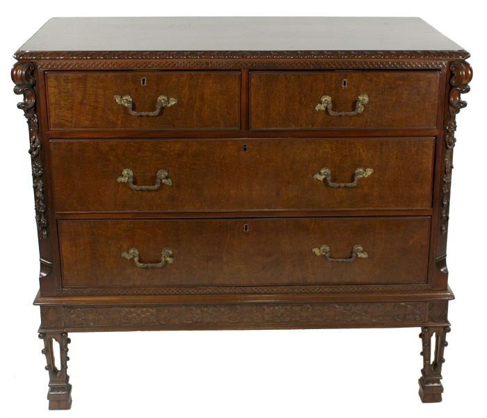 A George III Mahogany Chest of Drawers, in the Man: A George III Mahogany Chest of Drawers, in the Manner of Thomas Chippendale, 1760's, A later added mahogany top with carved molded edge over a thin frieze with gothic fretwork above two side by side d