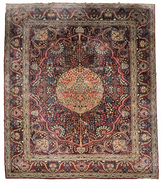 An Antique Lavar Kerman Wool Rug.