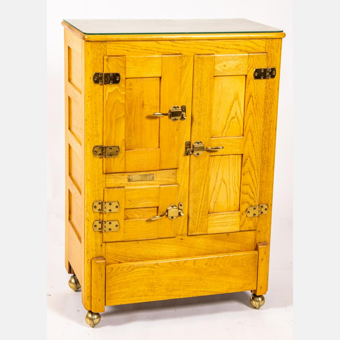 American Oak Ice Box Modified into a Bar: An American Oak Ice Box Modified into a Bar Cabinet, 20th Century, On castor wheels. H: 42 1/8 W: 28 3/4 D: 17 1/4 in.