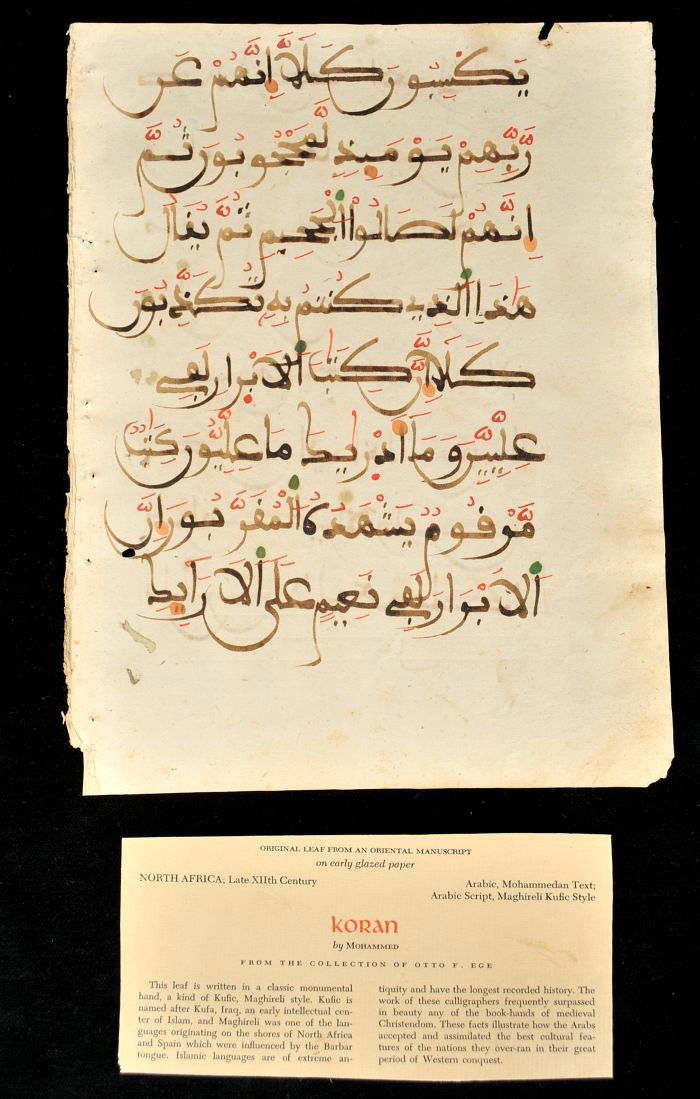 A North African Folio from a Maghribi Qur'an, 17th: A North African Folio from a Maghribi Qur'an, 17th Century, Recto and verso with sixteen lines of fine large Maghribi script in dark brown ink on glazed paper with voweling and diacriticals in red, gr