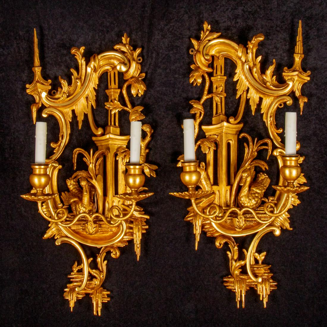 Pair of George III Carved Giltwood Wall Sconces in the Manner of Thomas Johnson: A Pair of George III Carved Giltwood Wall Sconces in the Manner of Thomas Johnson, 18th Century, With 20th century electrical modifications. H: 29 1/2 W: 12 1/2 in. These sconces were purchased in Lon