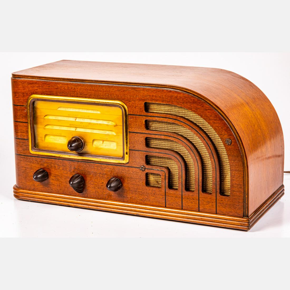 General Electric Art Deco Tube Radio Receiver, ca. 1935: A General Electric Art Deco Tube Radio Receiver, ca. 1935, Model F63. Having walnut case. H: 8 5/8 W: 17 1/8 D: 7 1/2 in. The absence of a condition statement does not imply that the lot is in perfect