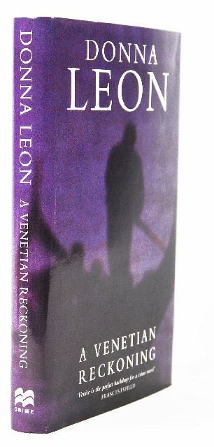 LEON, Donna (b. 1942). A Venetian Reckoning.: LEON, Donna (b. 1942). A Venetian Reckoning. London: Macmillan, 1995. 8vo. Original blue cloth, gilt-lettered on spine; dust jacket. FIRST UK EDITION of Leon's fourth book in the Guido Brunetti crime 