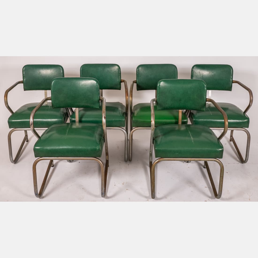 Six. K.E.M. Weber for Llyod Tubular Chrome Arm Chairs: Six. K.E.M. Weber (1899-1963) for Llyod Tubular Chrome Arm Chairs, 20th Century, Original vinyl upholstery replaced. H: 31 1/2 W: 21 D: 19 1/4 in. From the Estate of Douglas W. Lucak The absence of a