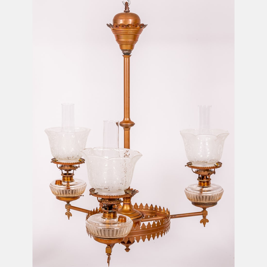 A Brass Aesthetic/Eastlake Oil Chandelier: A Brass Aesthetic/Eastlake Oil Chandelier, 19th Century, With original acid etched shades and oil bowls. H: 35 W: 27 in.