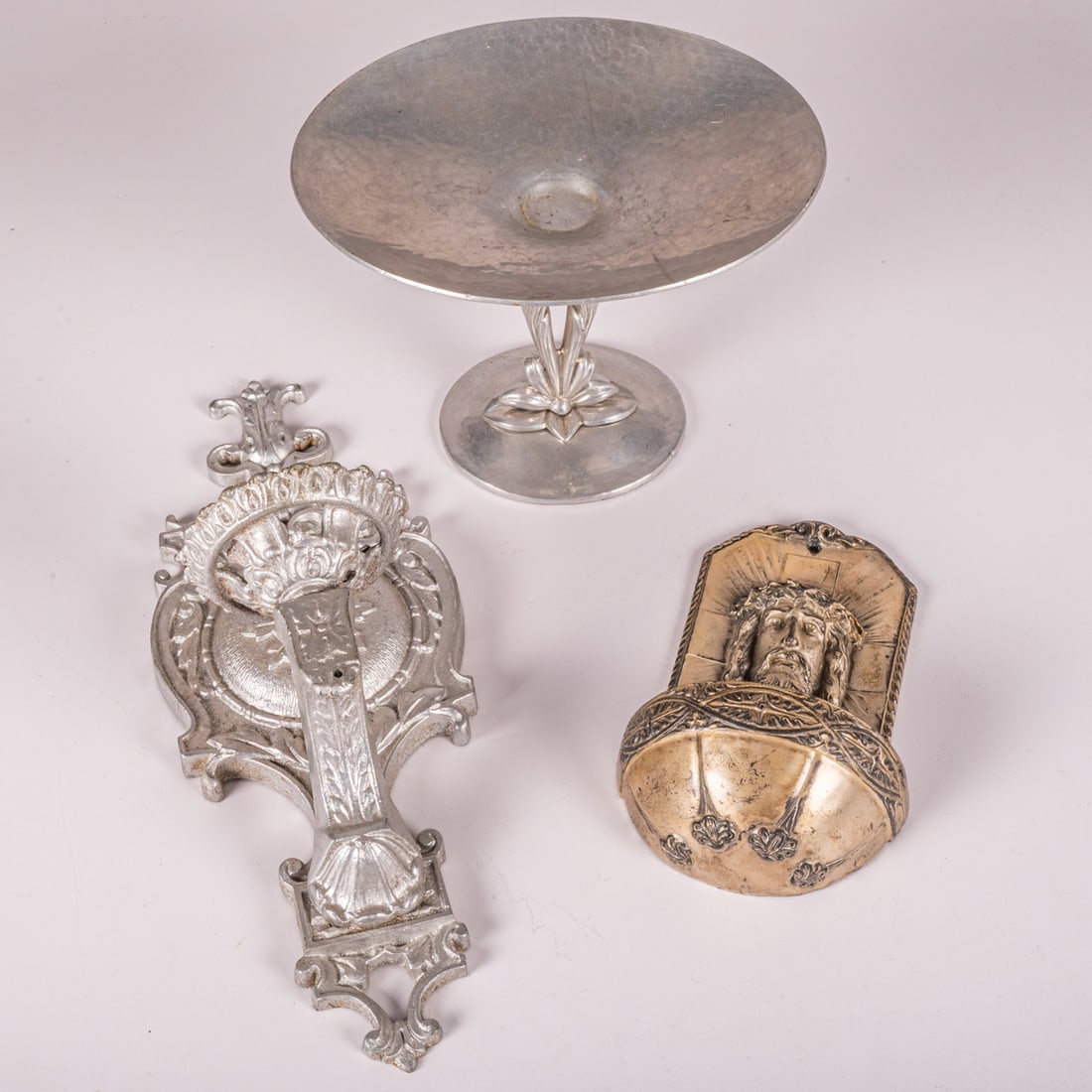 Vintage Aluminum and Spelter Decorative Objects: Vintage Aluminum and Spelter Decorative Objects, 20th Century, Including a Cellini-craft Argental cast and hammered aluminum compote, a cast and silvered spelter holy water wall fount and a cast alumi