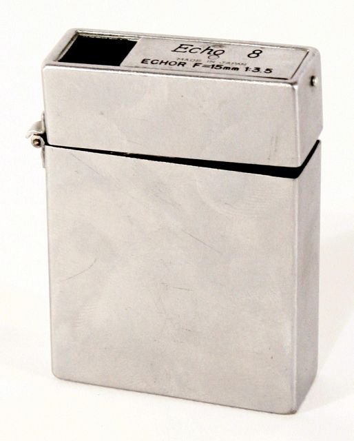 An Echo 8 Set 1951 Suzuki, Japan, Combination Subm: An Echo 8 Set 1951 Suzuki, Japan, Combination Subminiature Camera and Zippo Designed Cigarette Lighter for 5x5 mm or 16 mm film. Height: 2.13 Width: 1.63