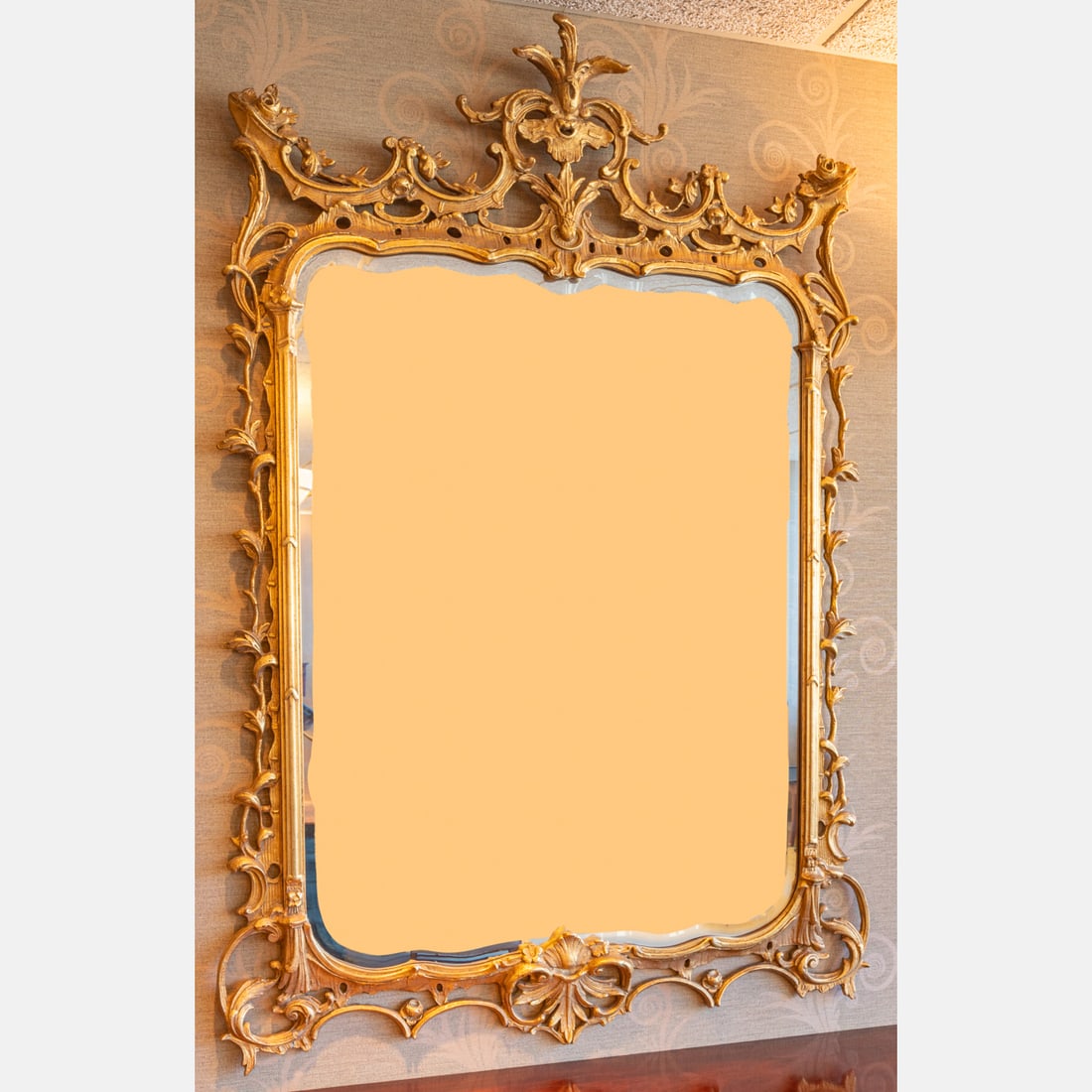Chippendale Style Gilt Wood and Beveled Glass Mirror: A Chippendale Style Gilt Wood and Beveled Glass Mirror, 20th Century. H: 68 1/2 W: 47 in. **Must be picked up within 2 weeks of auction date. Pick up location located in Cleveland, Ohio