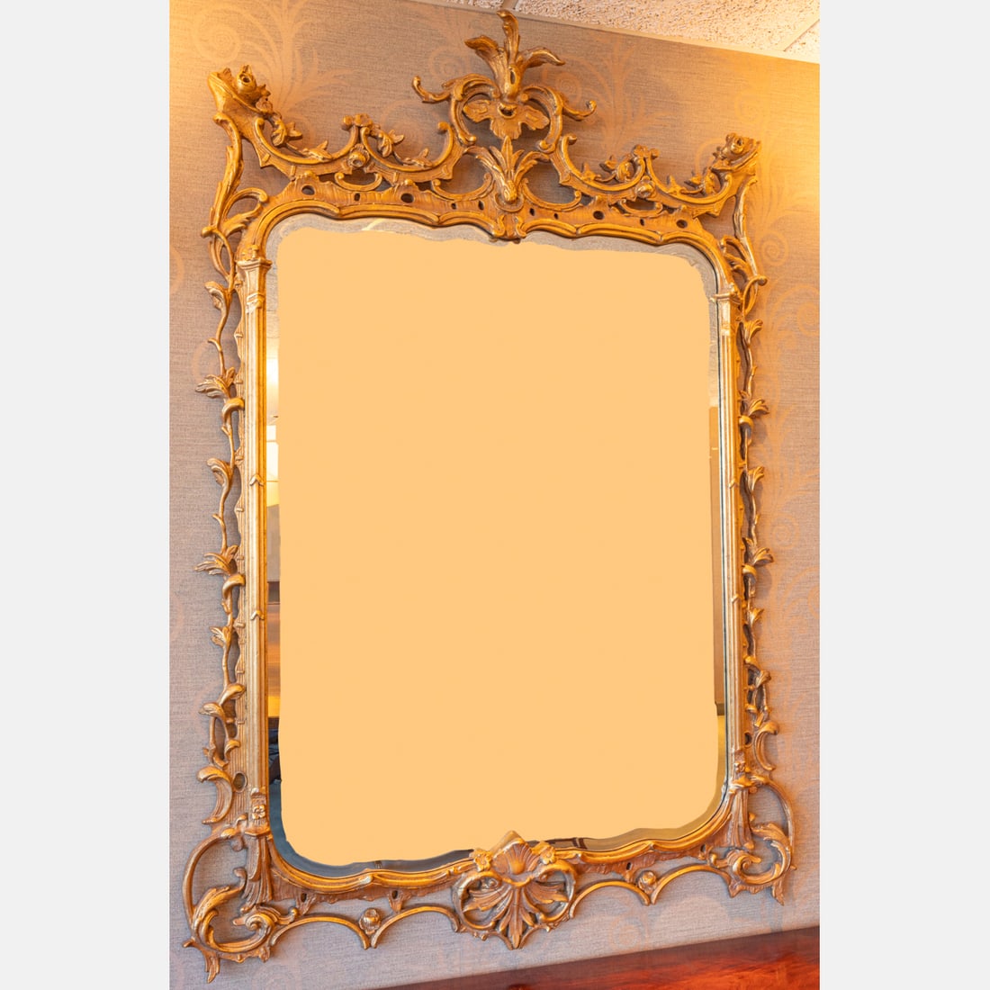 Chippendale Style Gilt Wood and Beveled Glass Mirror: A Chippendale Style Gilt Wood and Beveled Glass Mirror, 20th Century. H: 68 1/2 W: 47 in. **Must be picked up within 2 weeks of auction date. Pick up location located in Cleveland, Ohio