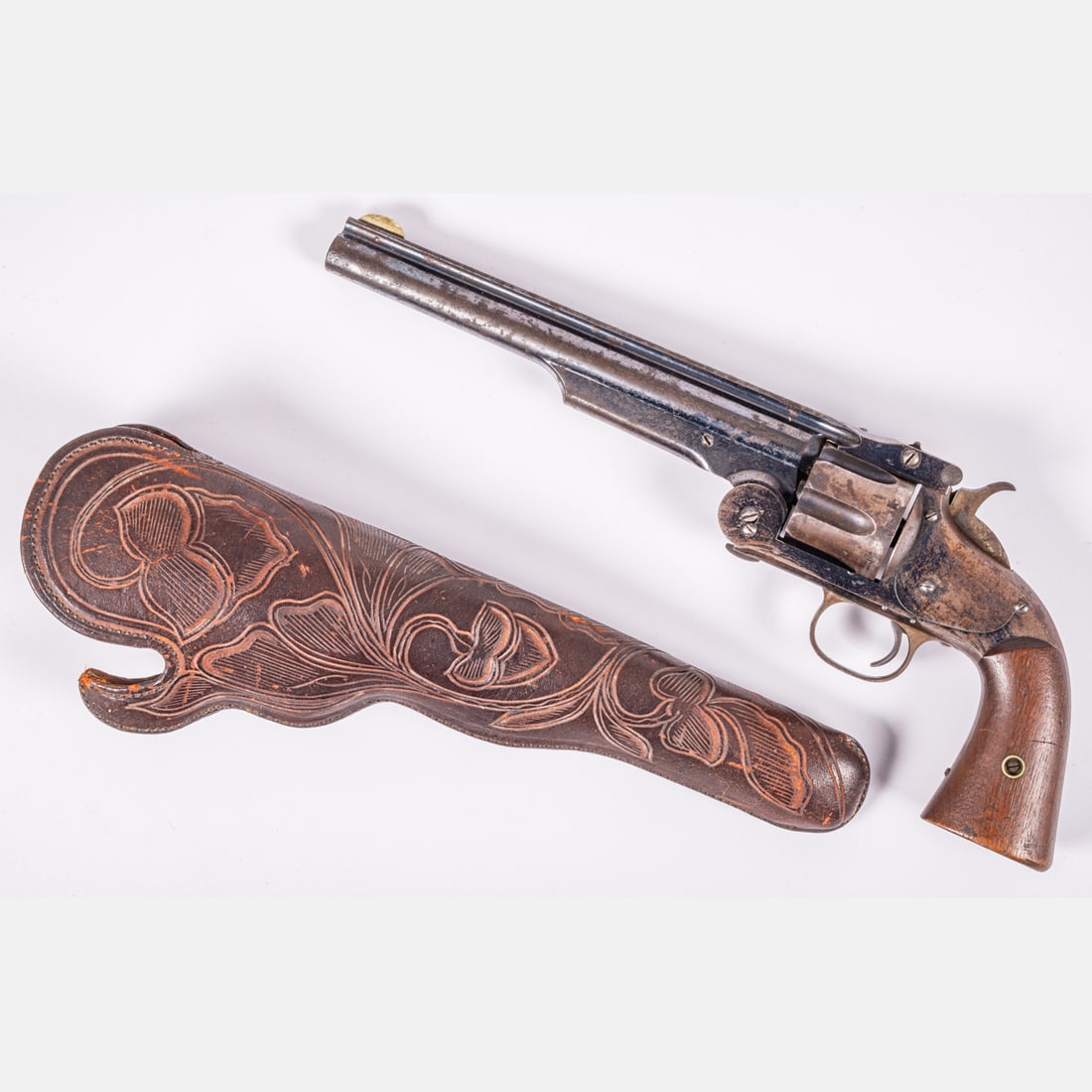 Smith & Wesson No. 3 American First Model Single Action Revolver: A Smith & Wesson No. 3 American First Model Single Action Revolver, 44 caliber. Serial # 2237, 8 inch fluted barrel, single action, with blued finish and walnut grips. Rib and long ejector housing. Ri