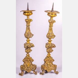 Pair of Italian Baroque Gilt Prickets/Altar Sticks: A Pair of Italian Baroque Gilt Prickets/Altar Sticks, ca. 18th Century, Baroque tall altar candlesticks, also known as prickets, with repousse brass over wood. With 20th century replaced support eleme