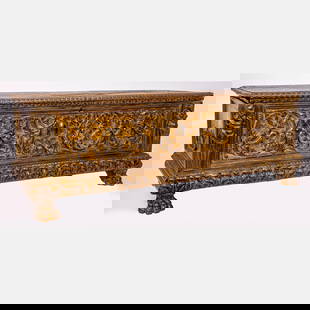 An Italian Baroque Carved Walnut Cassone: An Italian Baroque Carved Walnut Cassone, 17th/18th Century, Having carved opening top cover supported with wrought iron hinges. The front panel with male and female figural pilasters flanking carved