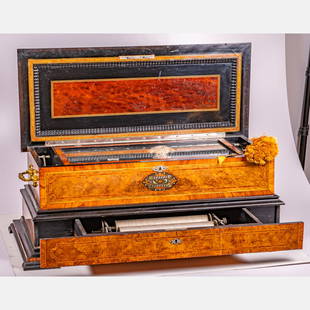 A Swiss Cylinder Music Box in Rosewood Case: A Swiss Cylinder Music Box in Rosewood Case, 19th Century, With 3 interchangeable 13 inch cylinders numbered: 53159 | I, II, III. In a rosewood and burl wood case with ebonized trim and lower