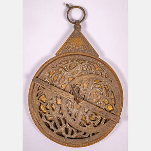 Islamic Persian Engraved Brass Astrolabe: An Islamic Persian Engraved Brass Astrolabe, 19th/20th Century, Having 5 two sided engraved discs. H: 10 3/4 W: 7 1/8 D: 9/8 in. From the Estate of John A. Davidson, Jr. Proceeds to benefit the APL of