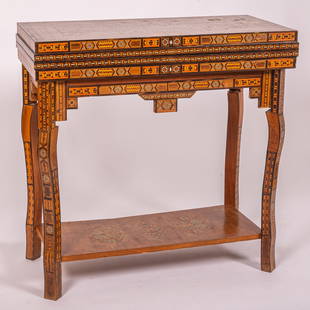 Persian Folding Games Table: A Persian Folding Games Table, 20th Century, With elaborate parquetry inlay of exotic wood and mother of pearl throughout. Twist top opens to green inlay felt, with a backgammon inset with chess board