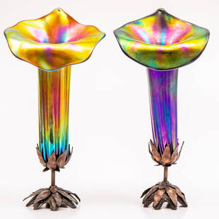 A Pair of John Cook Phoenix Studio Art Glass Lamps: A Pair of John Cook Phoenix Studio Art Nouveau Iridescent Glass Lamps, 20th Century, Both Signed Cook C. 94. H: 15 W: 7 1/2 D: 6 in. From the Estate of John A. Davidson, Jr. Proceeds to benefit the AP