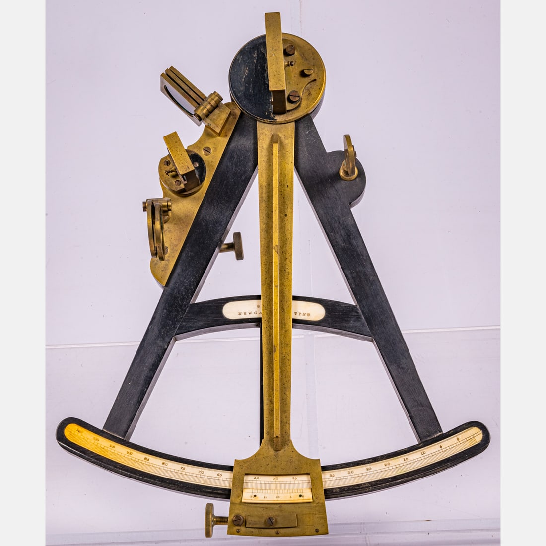 English Ebonized Wood and Bronze Octant, S.A. Cail: An Ebonized Wood and Bronze Octant, Septimus A. Cail, Newcastle, 19th Century, In a fitted oak case. Ebonized wood and bronze with bone inlay. Central bone plaque inscribed S.A. Cail, Newcastle on Tyn